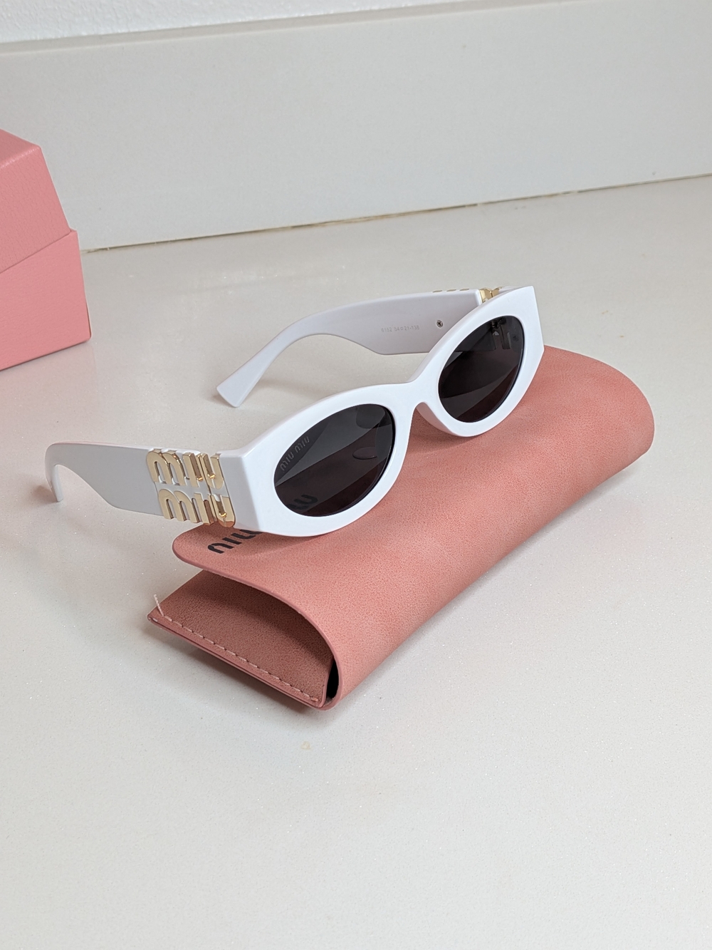 Miu Miu White Oval Sunglasses Gold Logo